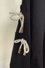 The-Brielle-Bow-Cut-Out-Sleeve-Knit-Black1.jpg